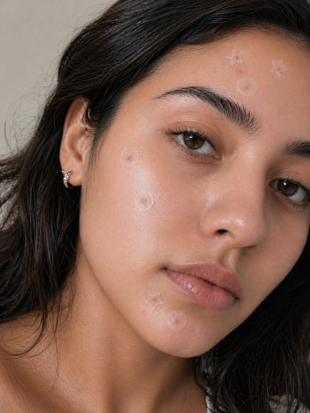 Close-up of a woman's face with visible pores and skin texture.