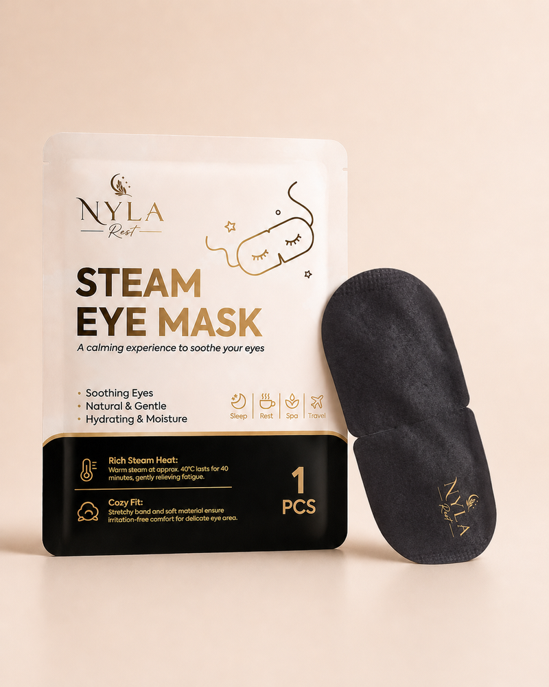 Nyla Rest Steam Eye Mask packaging and single mask on a beige background, showing the cotton material and ear-loop design